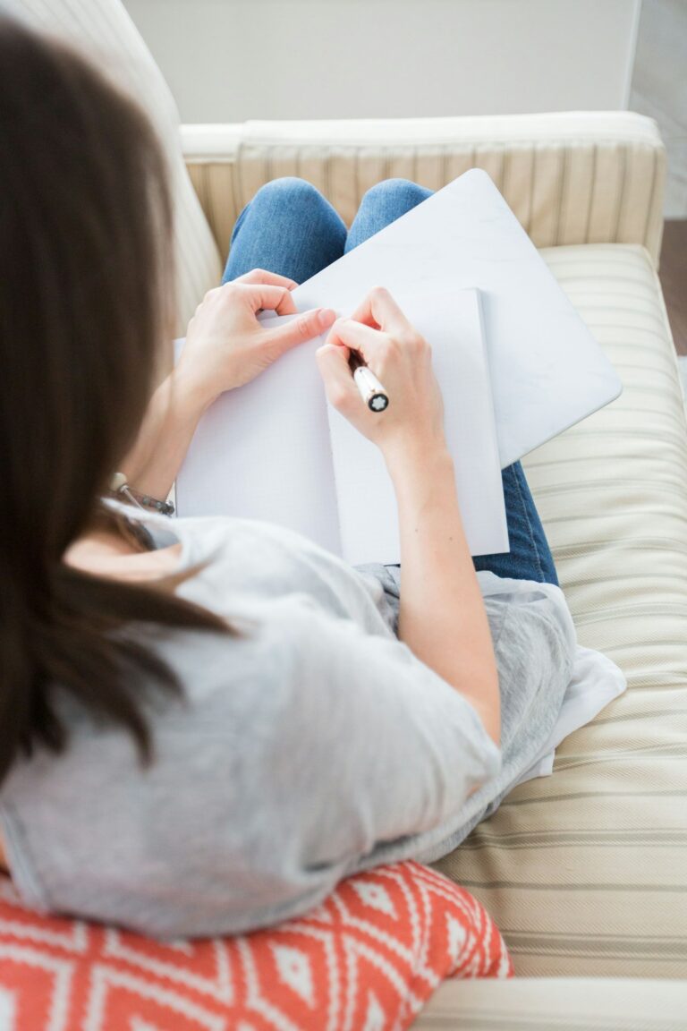 Woman journaling and reflecting on her dating standards